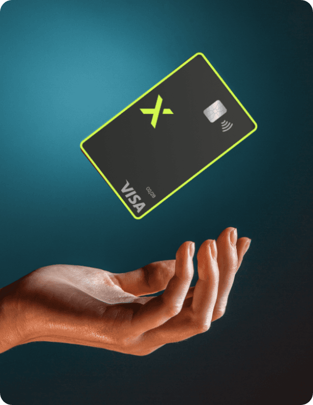 A hand holding up a black Felix Visa card